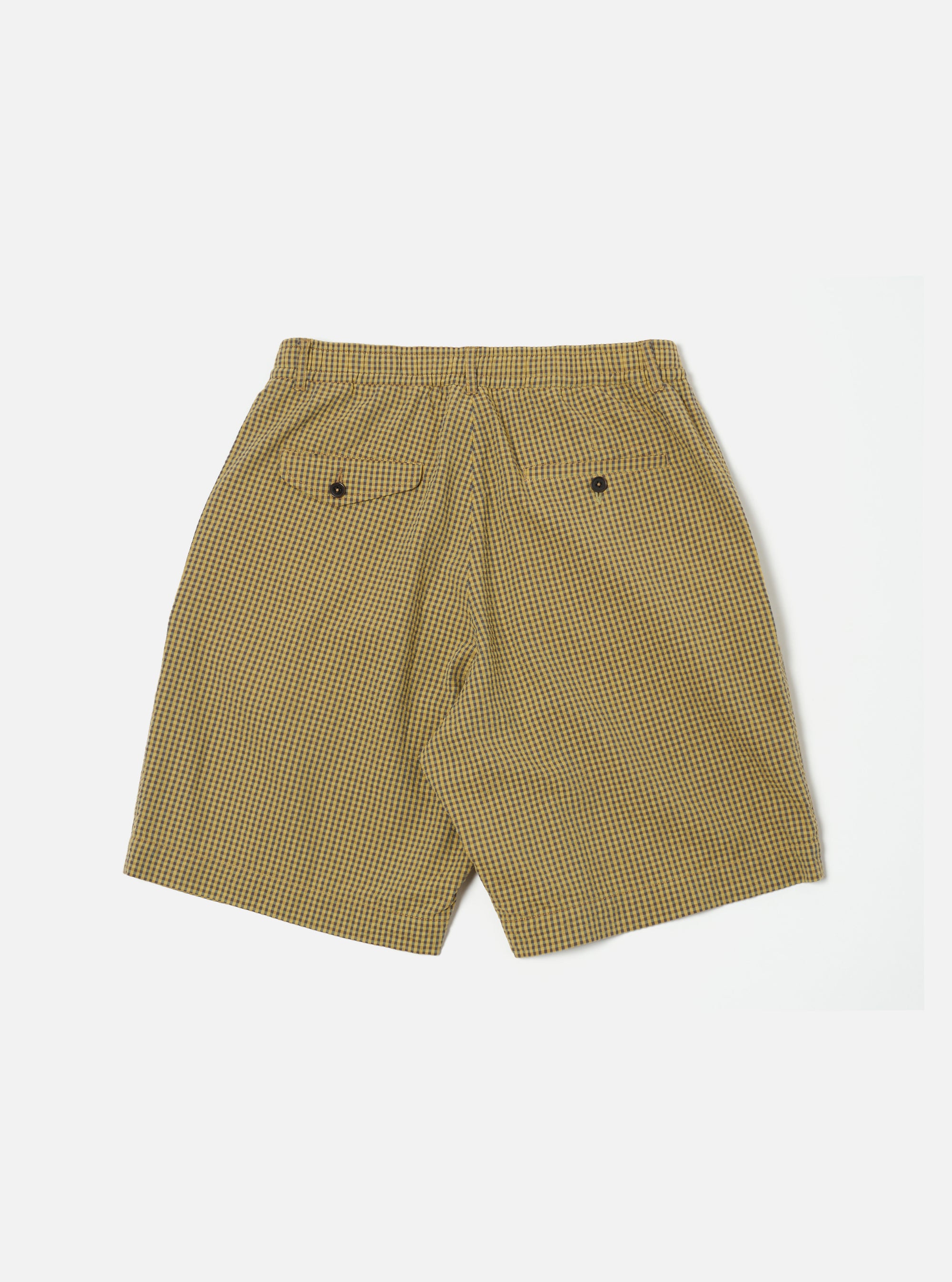 Back view of Yellow Japanese Seersucker Pleated Track Short on a white background. The shorts have a yellow and black checkered pattern and two pockets.