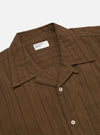 Close-up of the Brown Dobby Self Stripe Camper Shirt on a white background. The brown shirt has a subtle vertical stripe pattern and white buttons.