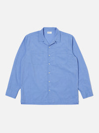Flat lay of a Blue End On End Cotton Garage Shirt on a white background. The shirt is long-sleeved with two chest pockets.