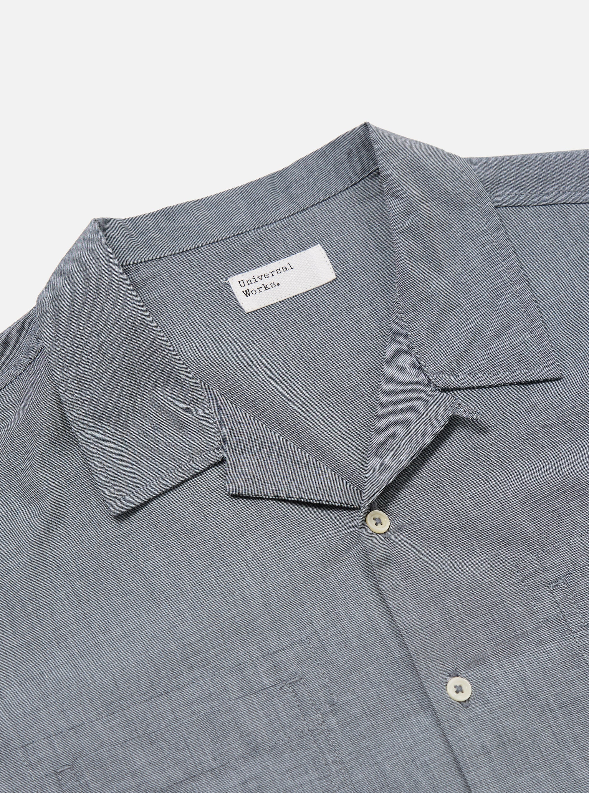 Close-up of the Grey End On End Cotton Garage Shirt on a white background. The shirt is made of a textured grey cotton and has a camp collar and two chest pockets.