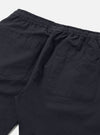Close-up of the back of Navy Linen Slub Weave Simple Short on a white surface. Shows the elastic waistband and back pockets.
