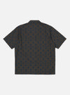 Back view of the Navy Mitla Print Cotton Road Shirt on a white background. The shirt is brown with a navy geometric print. Short sleeves, cotton material.