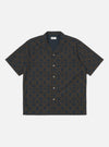 The Navy Mitla Print Cotton Road Shirt, featuring a navy and brown geometric pattern, is laid flat on a white background. The short-sleeved shirt has a camp collar and button-up design.