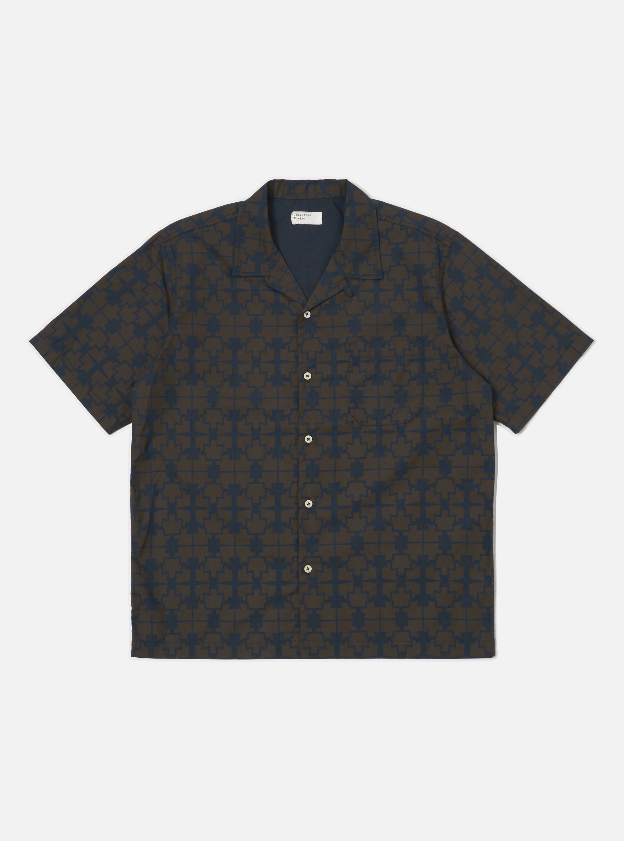 The Navy Mitla Print Cotton Road Shirt, featuring a navy and brown geometric pattern, is laid flat on a white background. The short-sleeved shirt has a camp collar and button-up design.