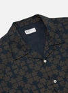 Close-up of the Navy Mitla Print Cotton Road Shirt on a white background. The shirt features a navy and brown geometric print, short sleeves, and a camp collar.
