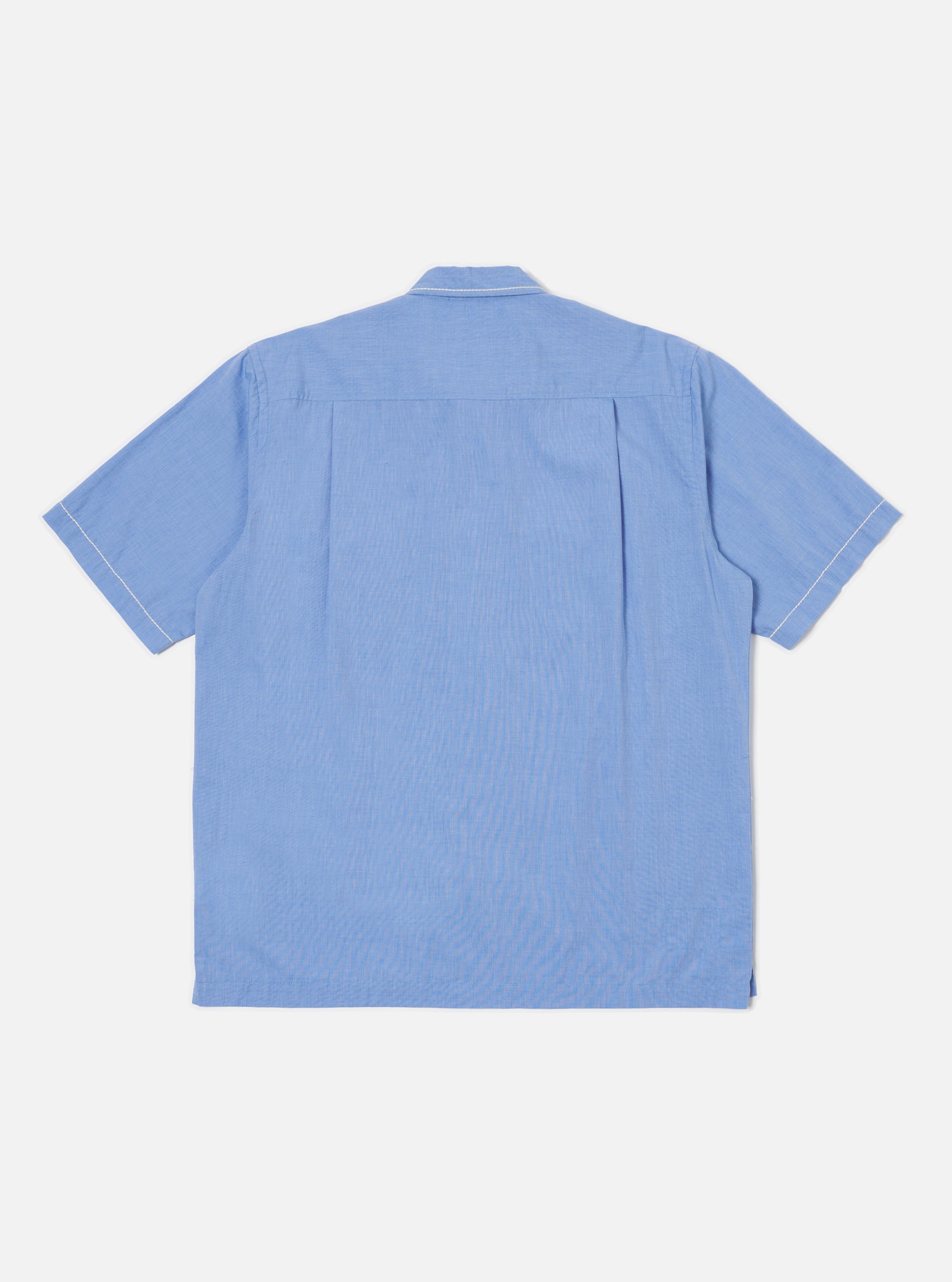 Back view of the Blue End On End Cotton Utility SS Shirt on a white background. The shirt is light blue with short sleeves and white stitching.