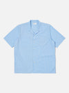 The Blue Vila Stripes Sal Road Shirt, a light blue and white striped short-sleeve shirt with two chest pockets, is laid flat on a white background.