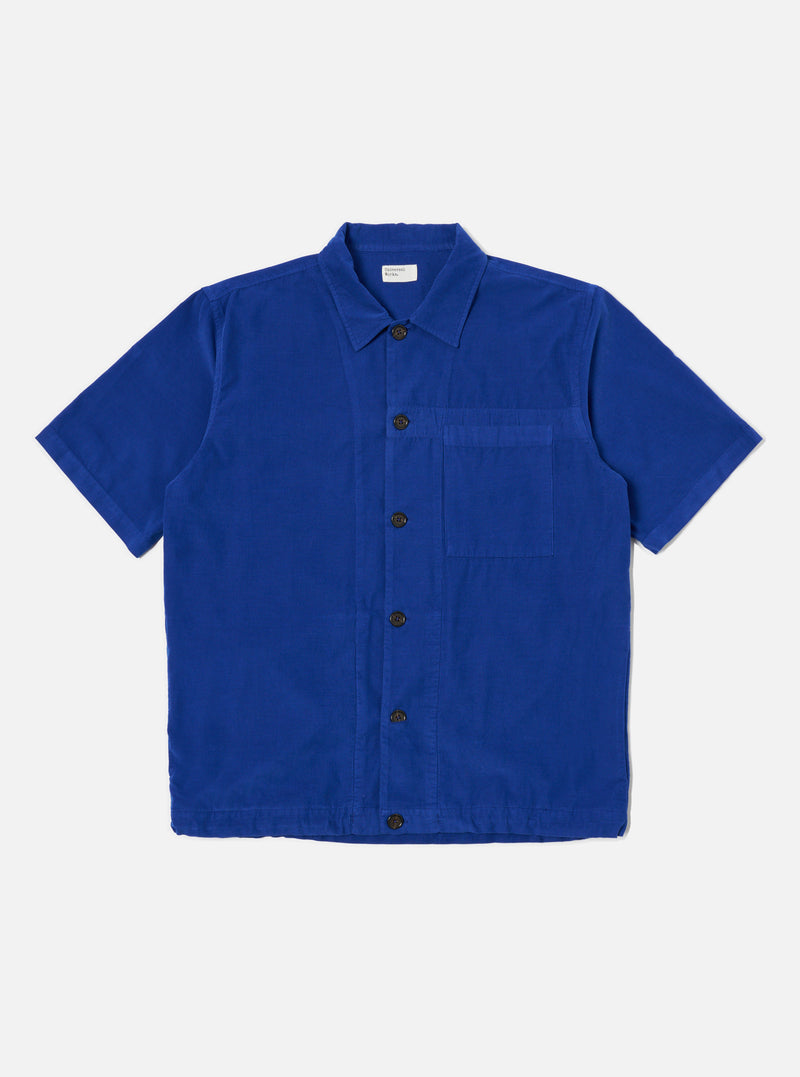 The Work Blue Summer Cord Tech Overshirt in vibrant blue corduroy. Short-sleeved, button-down on a clean white background. A stylish, lightweight overshirt.