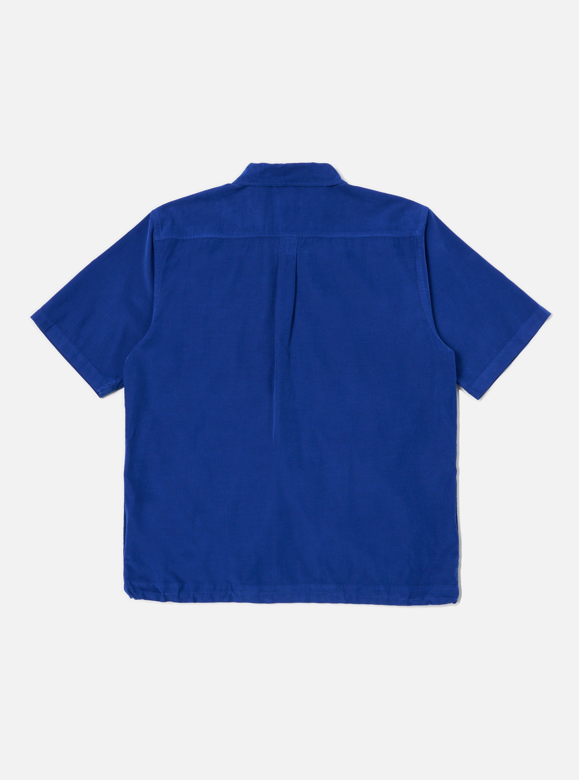 Back view of the Work Blue Summer Cord Tech Overshirt, a short-sleeved, blue corduroy shirt on a white background. The overshirt has a classic collar and a straight hem.