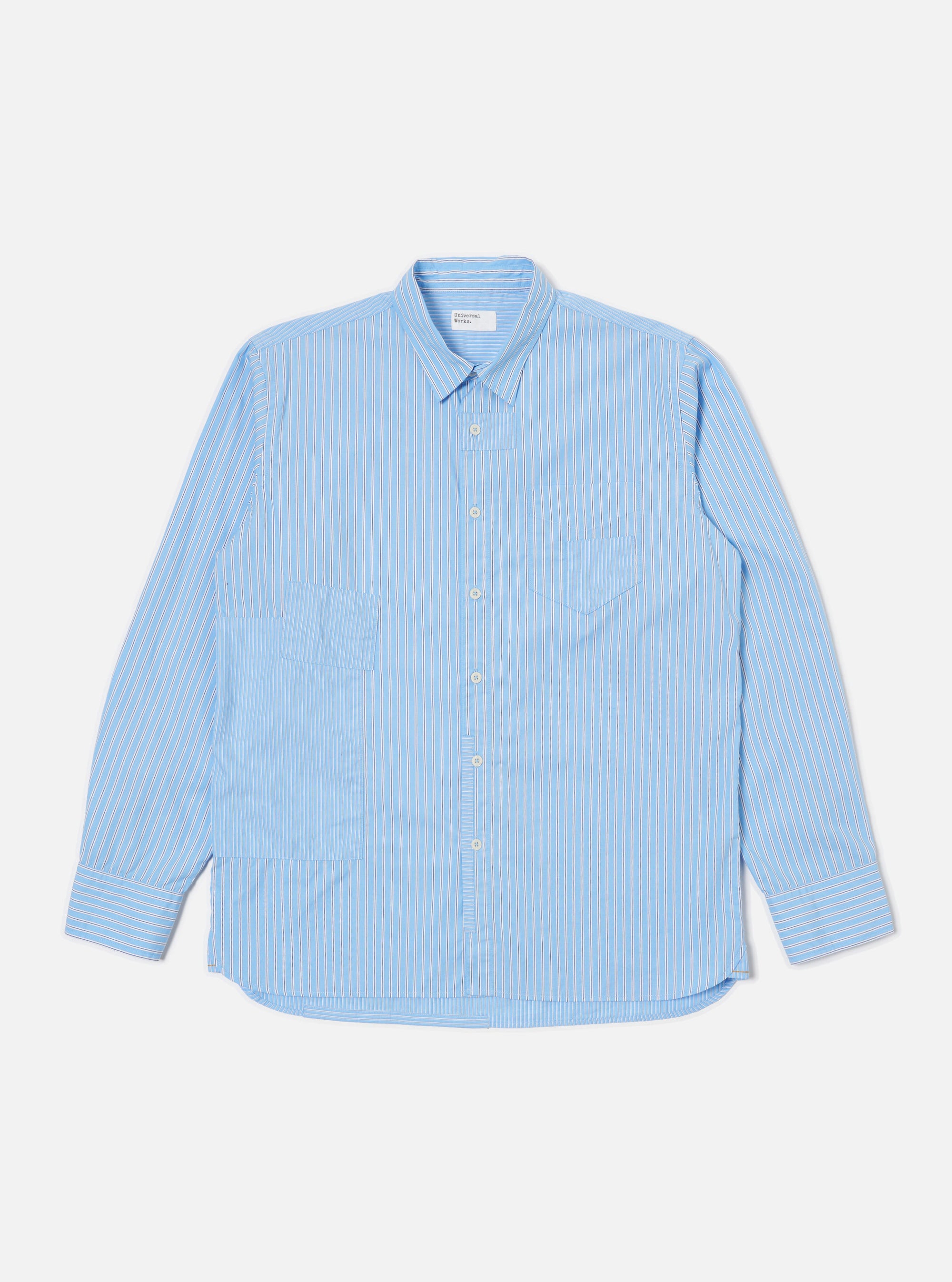 The Blue Vila Stripes Patched Shirt, a light blue and white striped cotton shirt with long sleeves, is laid flat on a white background.