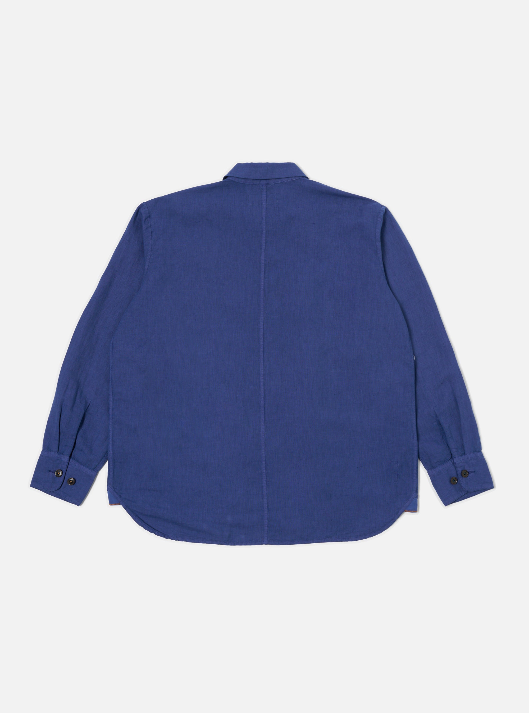 Back view of the Blue Linen Cotton Shirting Travail Overshirt on a white background. The blue overshirt has long sleeves and a classic collar.