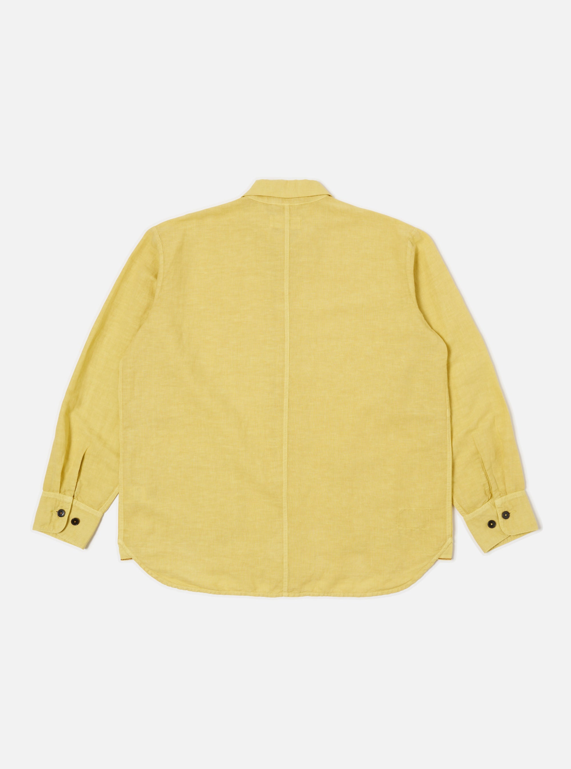 Back view of the Lemon Linen Cotton Shirting Travail Overshirt on a white background. The shirt is a light yellow color and has long sleeves with buttoned cuffs.