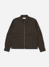 Close-up of the Navy Japanese Seersucker Zip Uniform Jacket on a white background. The jacket is a brown and black checkered pattern with a zip-up front and two pockets.
