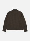 Back view of the Navy Japanese Seersucker Zip Uniform Jacket on a white background. The jacket has a brown and black checkered pattern and long sleeves.