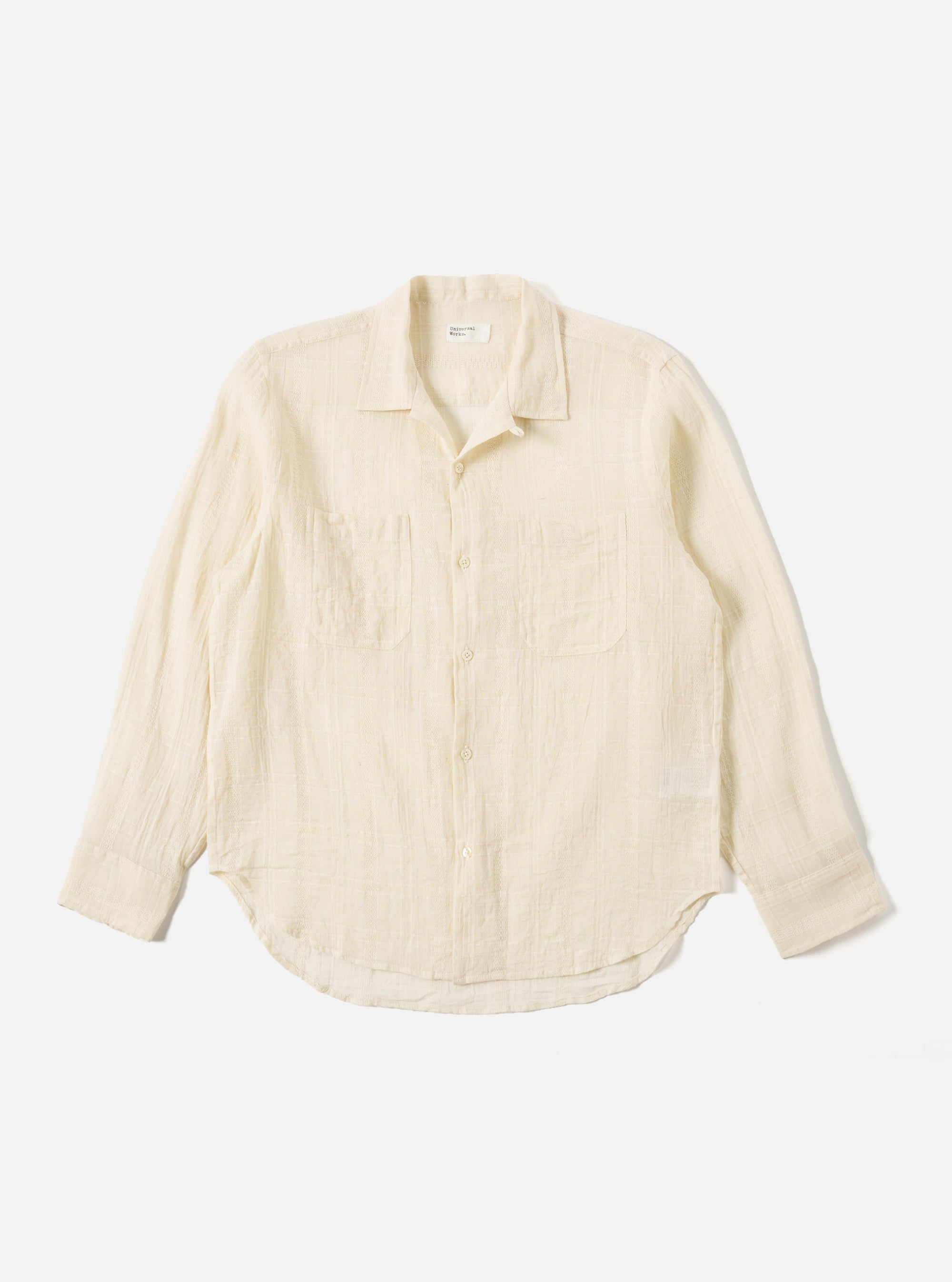 The Ecru Acapulco Weave Work Shirt, laid flat on a white background. The shirt is a light ecru color with a subtle weave pattern and long sleeves.