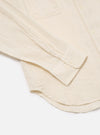 Close-up of the Ecru Acapulco Weave Work Shirt on a white surface. The shirt is ecru-colored with a subtle weave pattern and button details.