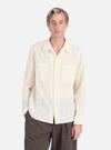 A man models the Ecru Acapulco Weave Work Shirt. The shirt is a light ecru color with a subtle weave pattern. He is standing against a plain white background.