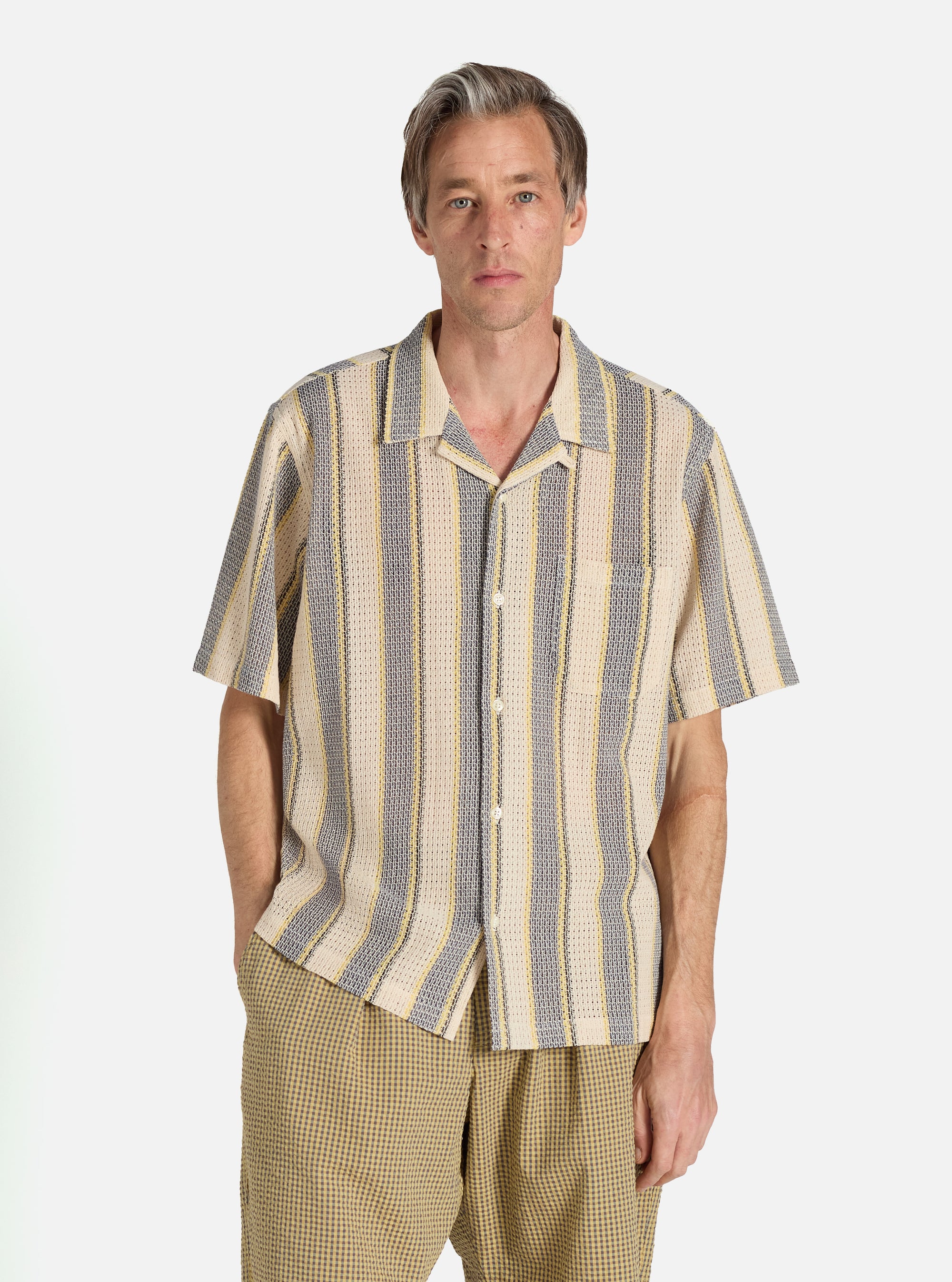 A model wears a Grey/Yellow Cotton Lattice Road Shirt. The shirt has vertical stripes. The background is a clean white.