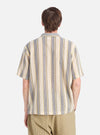 Back view of a model wearing the Grey/Yellow Cotton Lattice Road Shirt. The shirt features vertical stripes. The background is a clean, bright white.