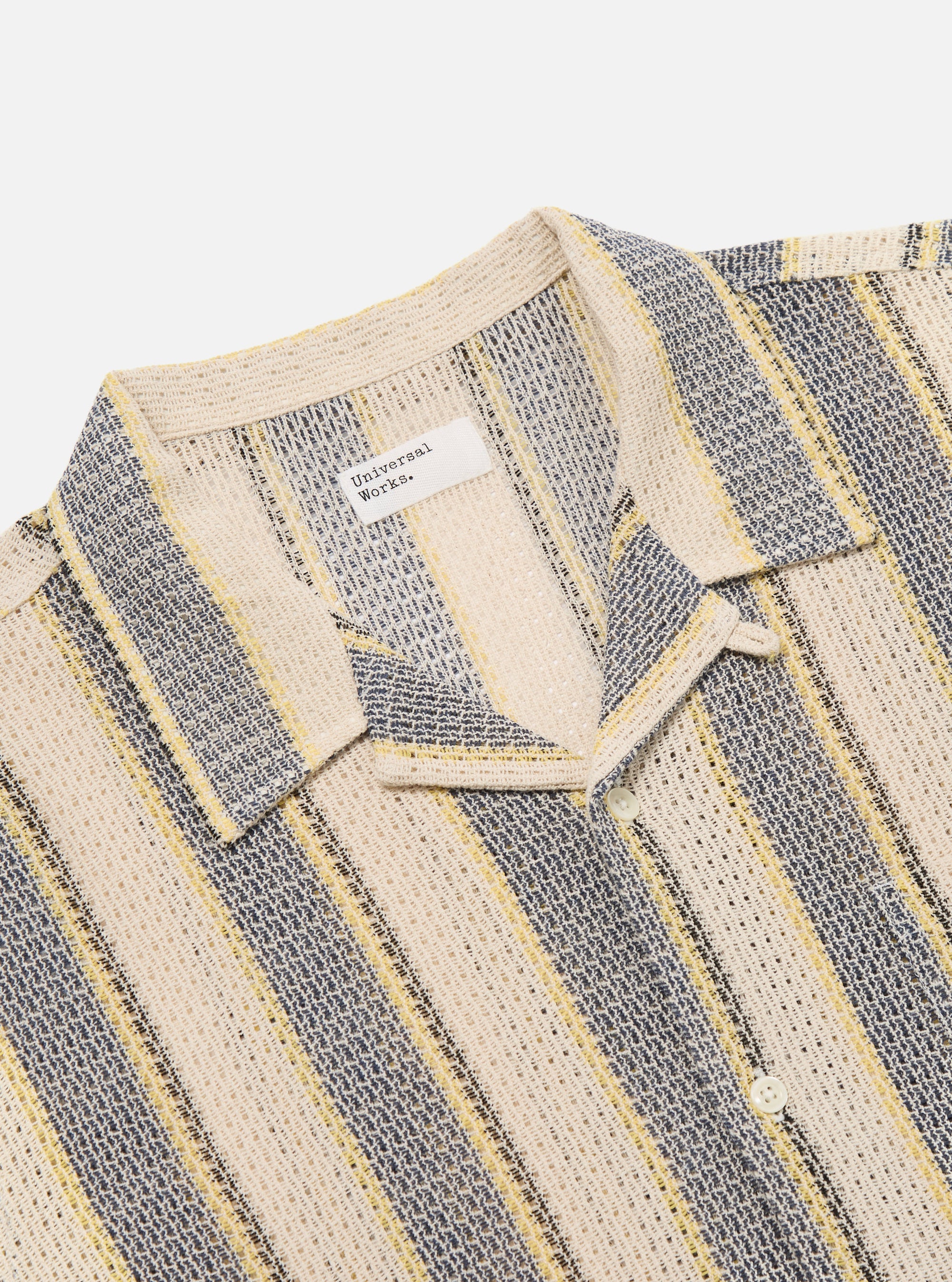 Close-up of the Grey/Yellow Cotton Lattice Road Shirt on a white background. The shirt features a striped pattern with grey, yellow, and cream colors. Made from a breathable cotton lattice material.