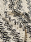 Close-up of the Charcoal Cotton Lattice Road Shirt, showing the fabric's texture and lattice pattern in charcoal and cream. The shirt is draped on a flat surface.