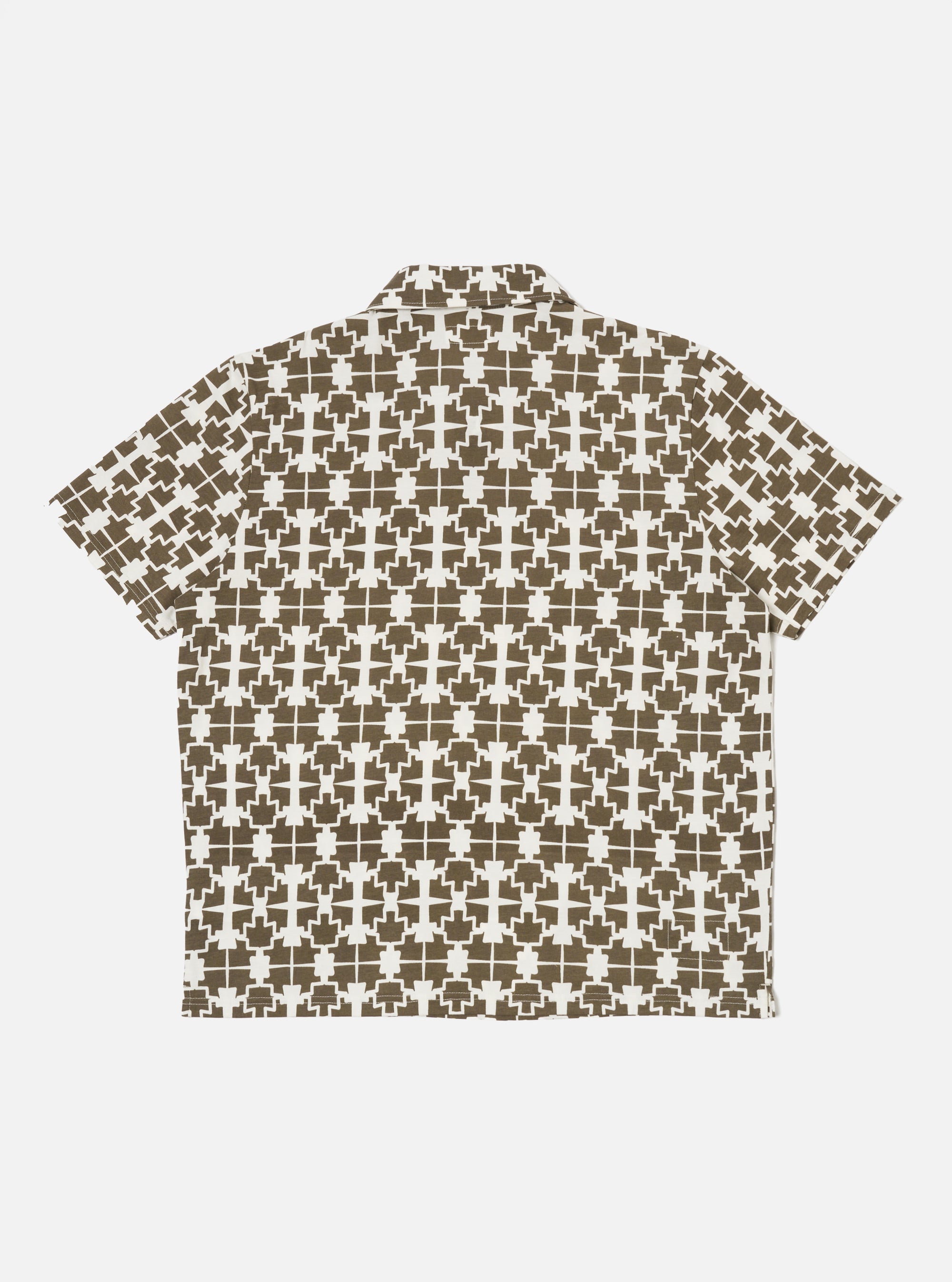 The Ecru/Mud Mitla Print Jersey Newlyn Polo shirt on a white background. The polo is ecru with a mud-colored geometric print. The shirt is short-sleeved.