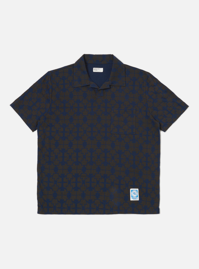 The Navy/Brown Mitla Print Jersey Newlyn Polo on a white background. The polo features a navy and brown geometric print and short sleeves.