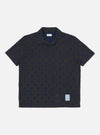 The Navy/Brown Mitla Print Jersey Newlyn Polo on a white background. The polo features a navy and brown geometric print and short sleeves.