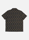 The Navy/Mud Mitla Print Jersey Newlyn Polo on a white background. The polo features a navy and mud geometric print.