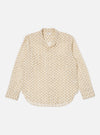 The Camel Mitla Weave Work Shirt, a cream-colored long-sleeve shirt with a brown geometric pattern, is laid flat on a white background.