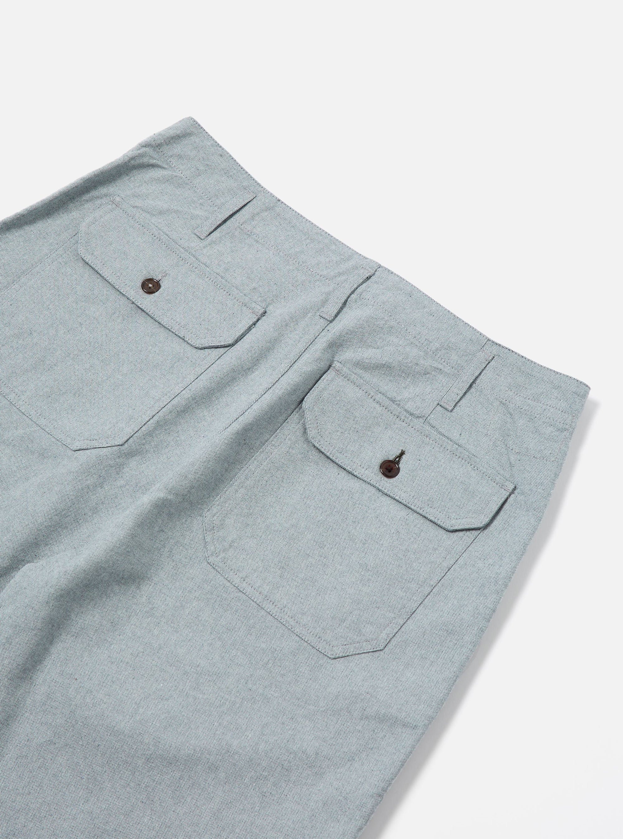 Close-up of the Indigo Reworked Jean Cloth Alva Short on a white background. Shows the back pockets with button closures and the jean cloth material.