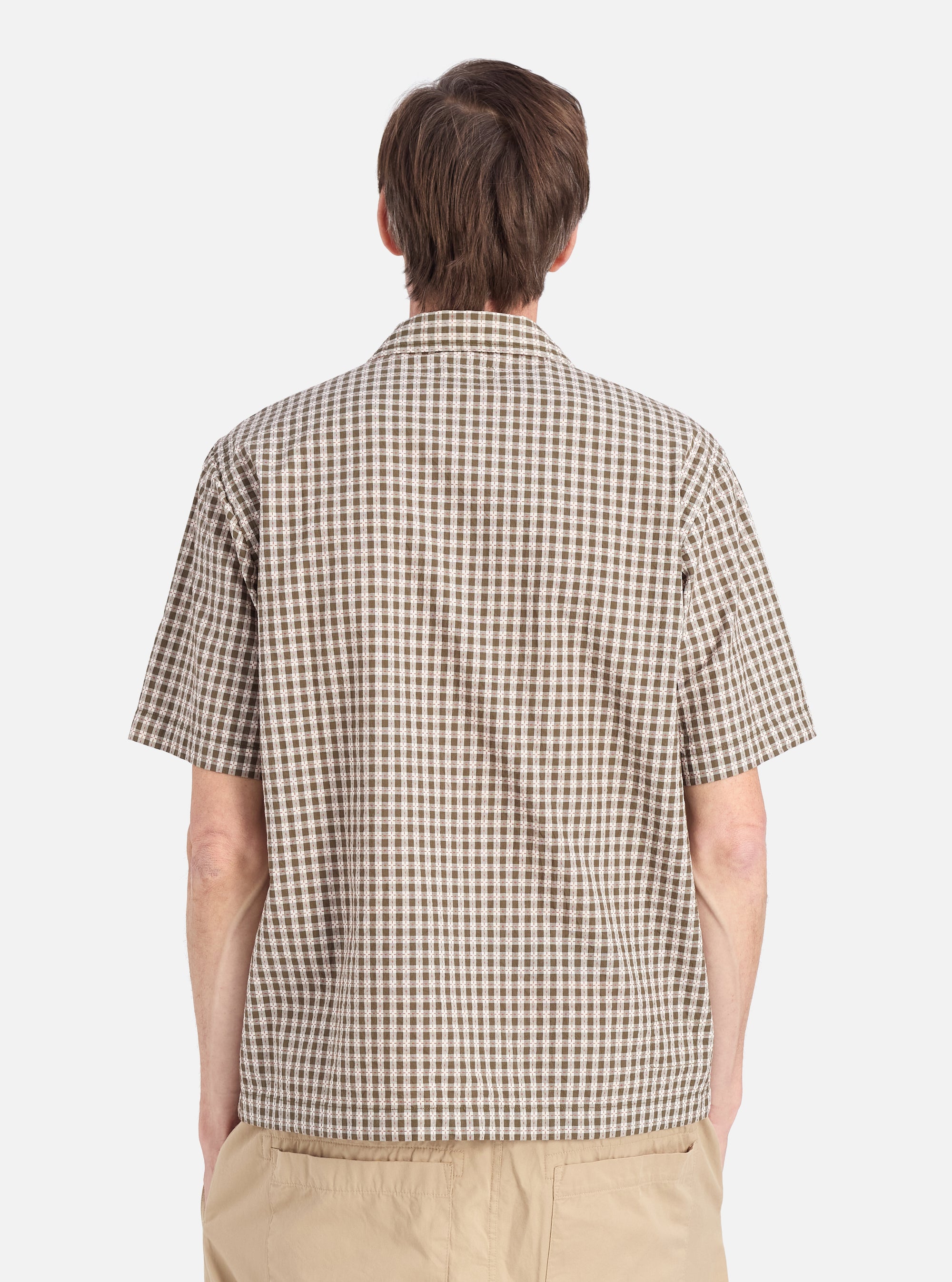 Back view of a model wearing the Olive Dobby Check Road Shirt. The shirt has a green and white check pattern. The background is a plain white studio backdrop.