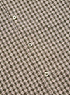 Close-up of the Olive Dobby Check Road Shirt, showcasing its olive and white check pattern with small red accents. White buttons are visible on the shirt's front.