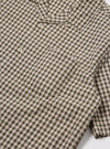 Close-up of the Olive Dobby Check Road Shirt, featuring a green and white checkered pattern with short sleeves. The shirt is laid flat on a white surface.