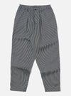 Studio shot of Indigo Hickory Stripe Denim Pleated Track Pant on a white background. The pants are striped with a relaxed fit.