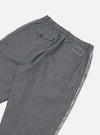 Close-up of the Indigo Hickory Stripe Denim Pleated Track Pant on a white background. The pants feature a striped pattern and a comfortable, relaxed fit.
