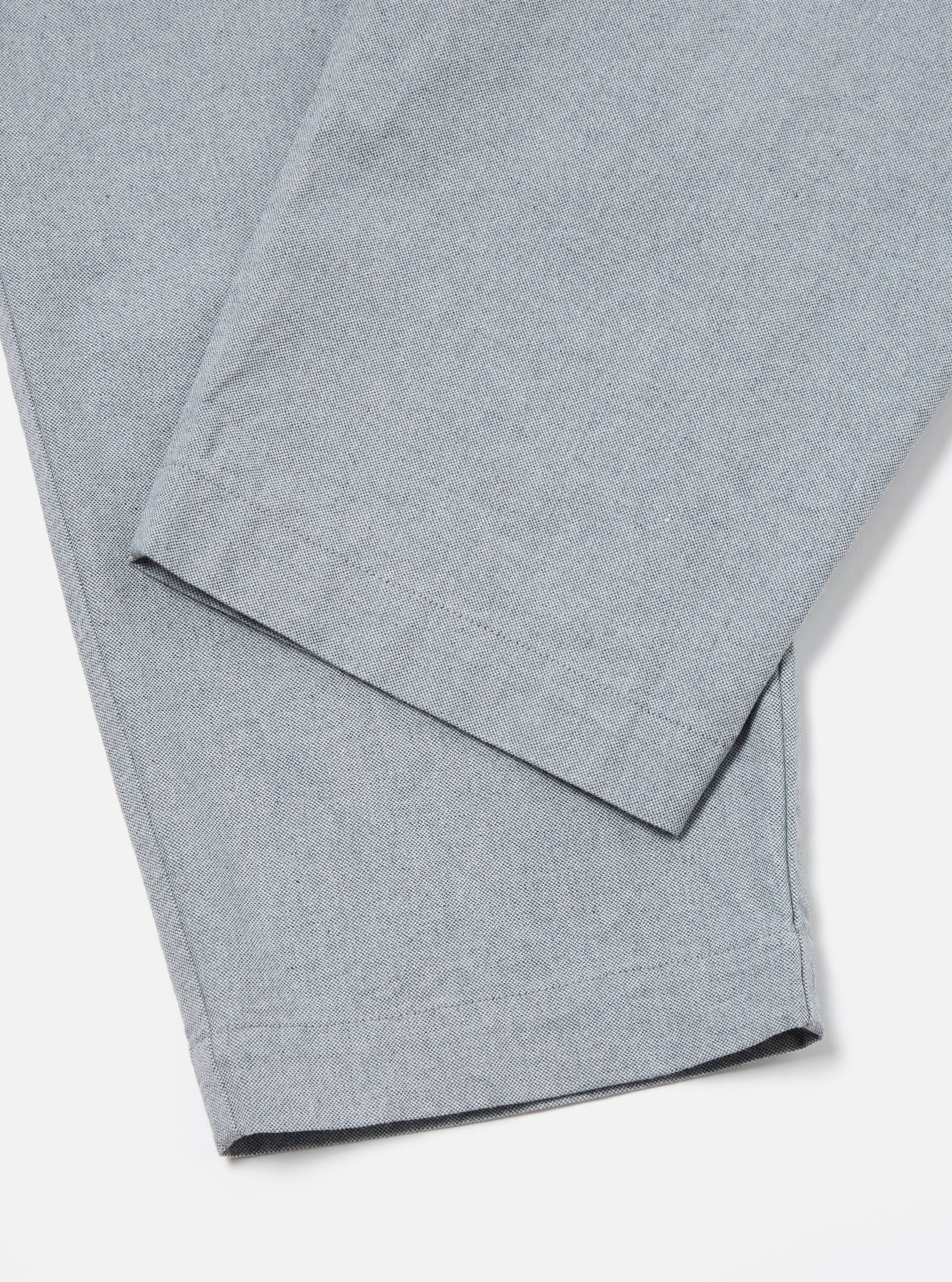 Close-up of the Indigo Reworked Jean Cloth Oxford Pant in light blue on a white background. The fabric has a subtle texture.