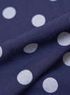 Close-up of the Navy Bold Dot Print Rayon Evening Scarf, showing the fabric's texture and the pattern of large white dots on a navy background.