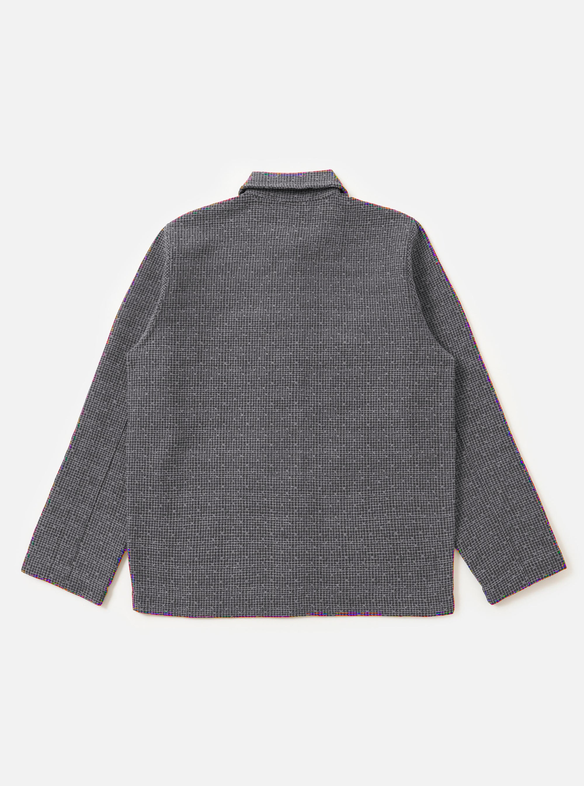 The Grey/Blue Jacquard Weave Field Jacket is displayed from the back, laid flat against a plain white background. The image highlights the straight-cut hem, plain hemmed cuffs, and the textured, knitted check pattern of the fabric.