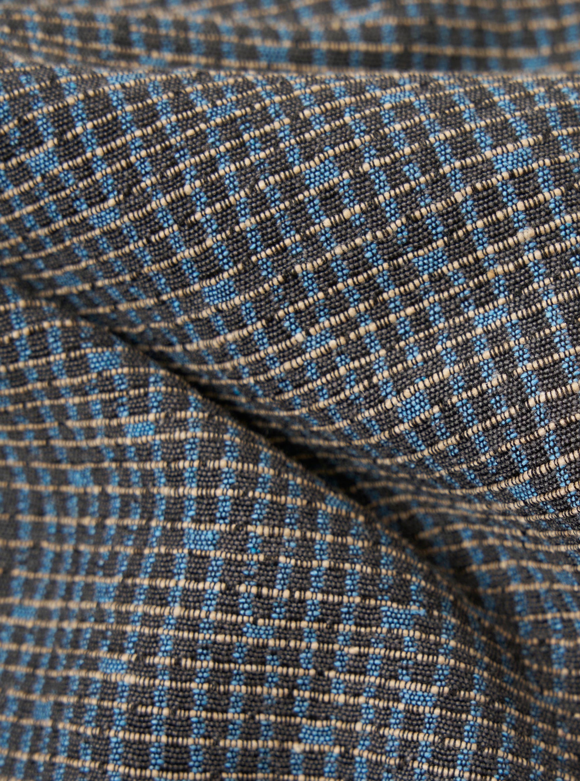 A close-up fabric swatch of the Grey/Blue Jacquard Weave Field Jacket shows a detailed view of the textured material. The intricate jacquard weave features a geometric pattern in shades of grey and blue.