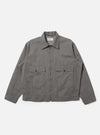 A Mid Grey Linen Slub Weave E130 Jacket is shown laid flat against a solid white background. The jacket features a classic pointed collar, a full button-down front, and two large rectangular patch pockets at the hips. The mid-grey linen fabric exhibits a distinct textured slub weave.