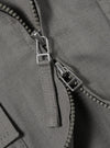 The Mid Grey Linen Slub Weave E130 Jacket is displayed from the back, laid flat against a solid white background. The image highlights the horizontal back yoke, the straight hem, and the textured slub weave of the grey linen fabric.