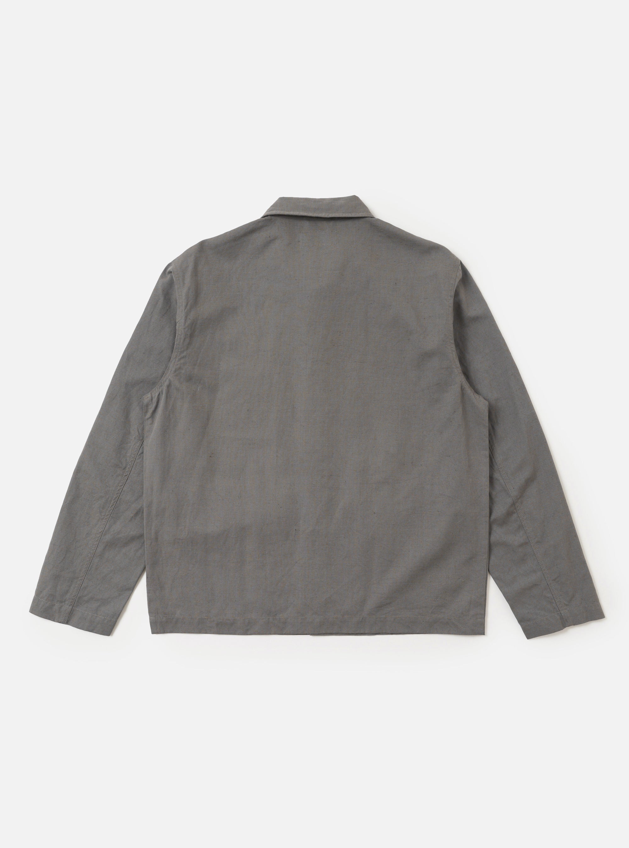 The Mid Grey Linen Slub Weave Franck Jacket is shown from the back as a flat lay against a plain white background. The image highlights the clean, simple construction of the garment's rear panel and the textured, slubbed appearance of the mid-grey linen-cotton blend fabric.