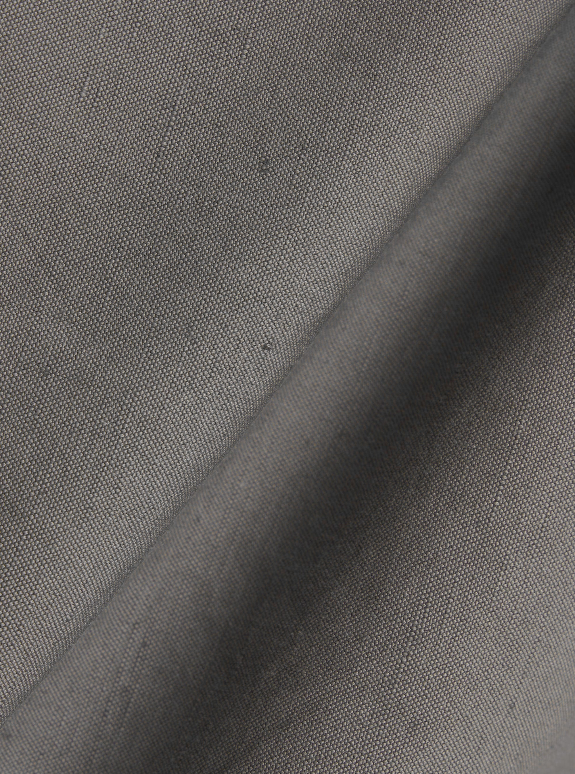 A close-up fabric swatch image of the Mid Grey Linen Slub Weave Franck Jacket. The image highlights the detailed texture of the mid-grey fabric, which features a visible, irregular slubbed weave.
