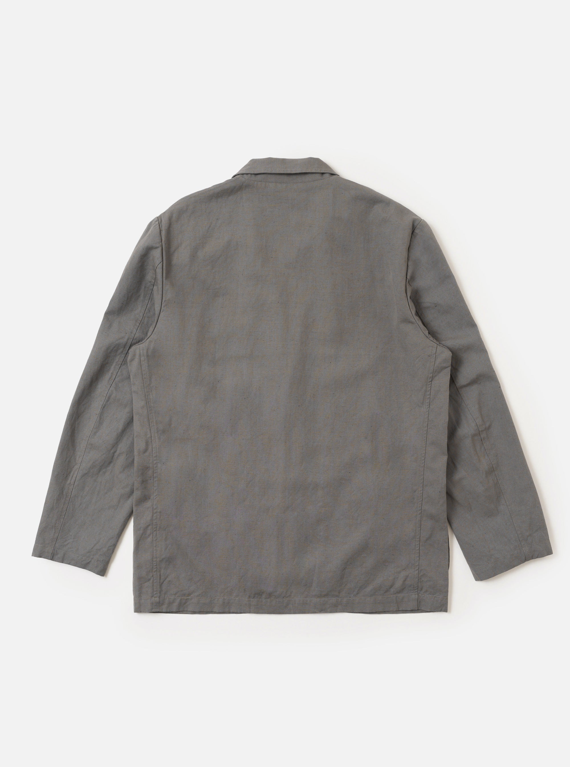The Mid Grey Linen Slub Weave Two Button Jacket is shown from a rear three-quarter angle, laid flat against a plain white background. The image highlights the jacket's structured back with vertical seams, two-piece sleeve construction, and the textured slub weave of the mid-grey linen-cotton fabric.