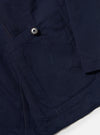 The Navy Linen Slub Weave Bakers Jacket is shown from the back, laid flat against a plain white background. The image highlights the textured, irregular slub weave of the navy blue cotton-linen fabric and the jacket's simple, straight-cut rear construction with a single-piece back panel and a clean hem.