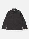 The Charcoal Seattle Cotton OG Bakers Jacket is shown laid flat against a solid white background. The charcoal grey jacket features a classic pointed collar, a five-button front closure, and four asymmetrical patch pockets on the front, including one chest pocket and one smaller internal-style pocket.