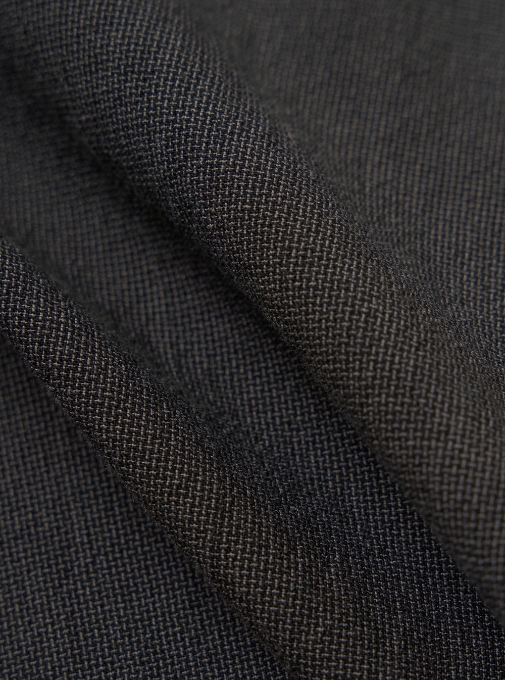A close-up fabric swatch of the charcoal grey Seattle cotton material used for the OG Bakers Jacket. The image highlights the textured weave and solid color of the fabric.