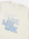 The Ecru Single Jersey Multi UW Print Multi UW Print Tee is displayed from a rear perspective, laid flat against a solid white background. The image highlights the short-sleeve construction, a simple crew neck, and a small woven branded label positioned near the straight hem.