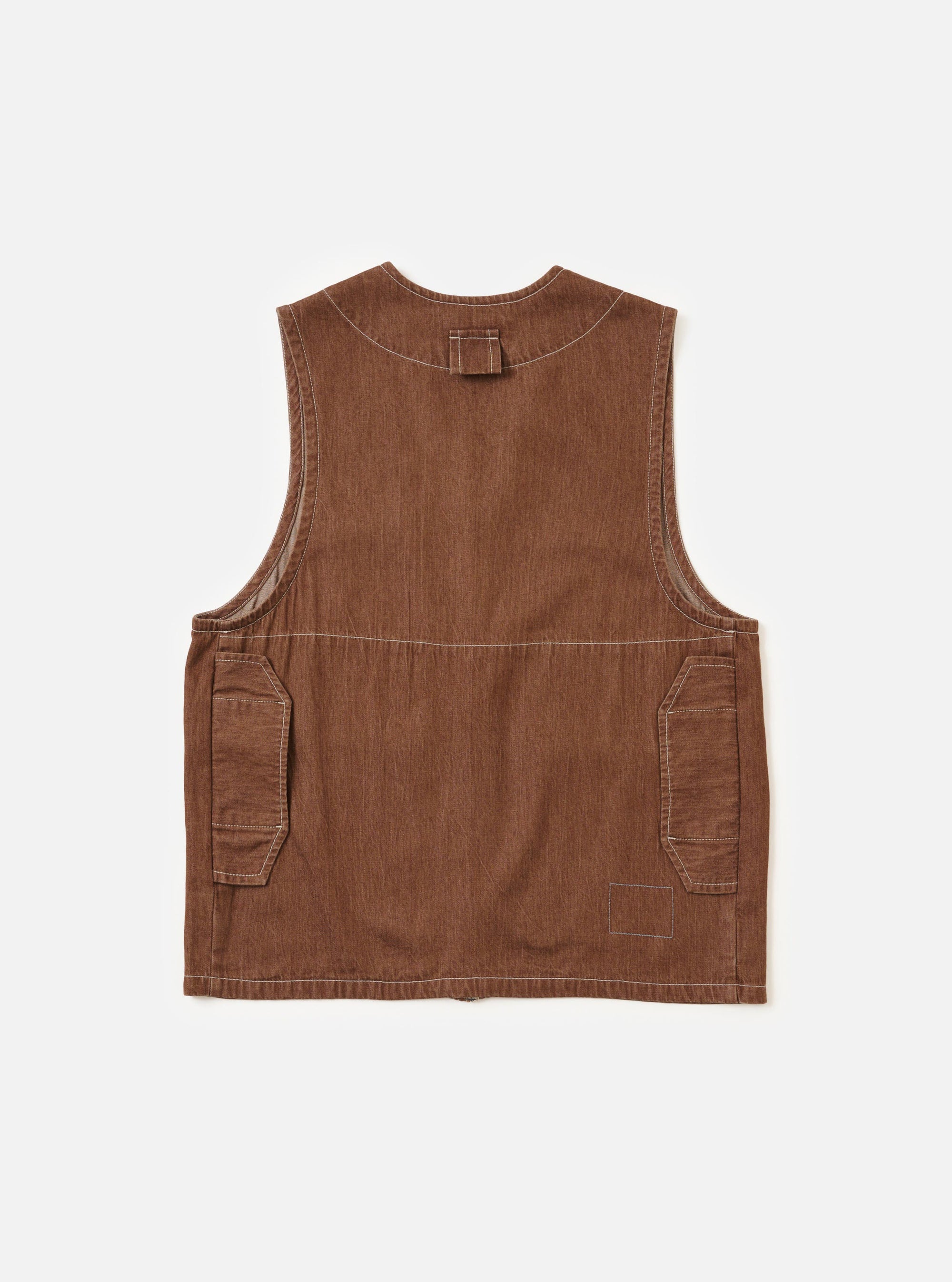 The back of the Brown Meco Denim Marine Gilet is displayed flat against a plain white background. The garment features a simple, sleeveless construction with a straight hem and visible tonal stitching across the denim fabric.